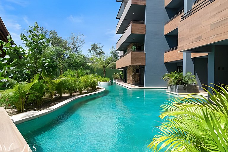 Stylish Pool View • 1BR w/Balcony • Sauna + Gym