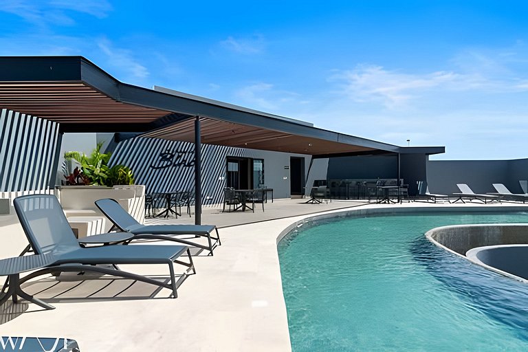 Stylish Pool View • 1BR w/Balcony • Sauna + Gym