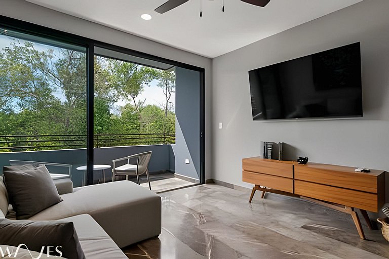 Stylish Pool View • 1BR w/Balcony • Sauna + Gym